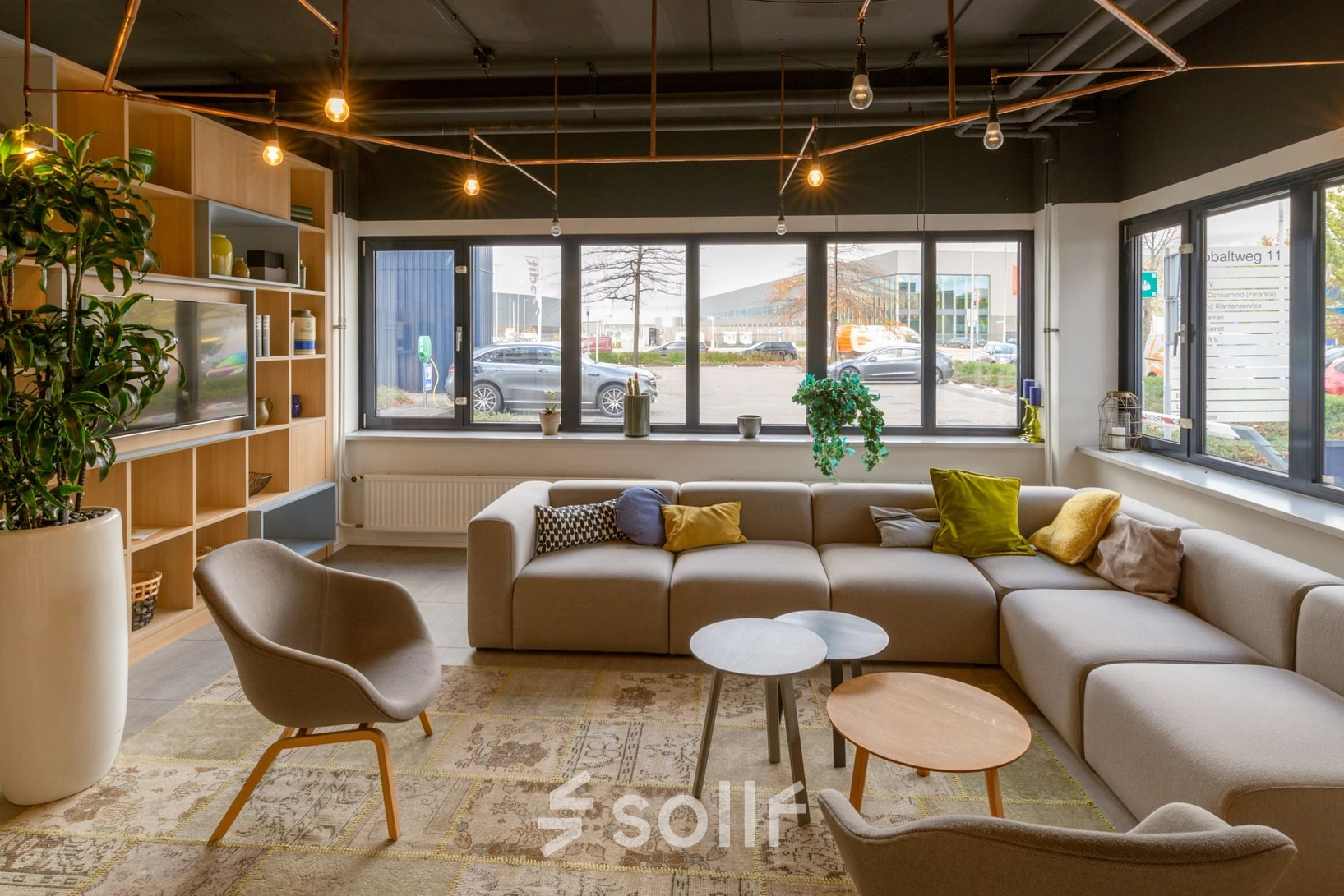 Comfortable and modern furnished workspace at Atoomweg 400, Utrecht Lage Weide. Perfect office space rental with cozy seating and large windows offering ample natural light.