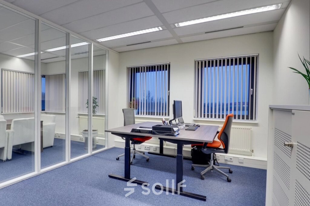 Bright, furnished office space for rent at Atoomweg 63, Utrecht Lage Weide, featuring modern desks and chairs, ideal for business activities.