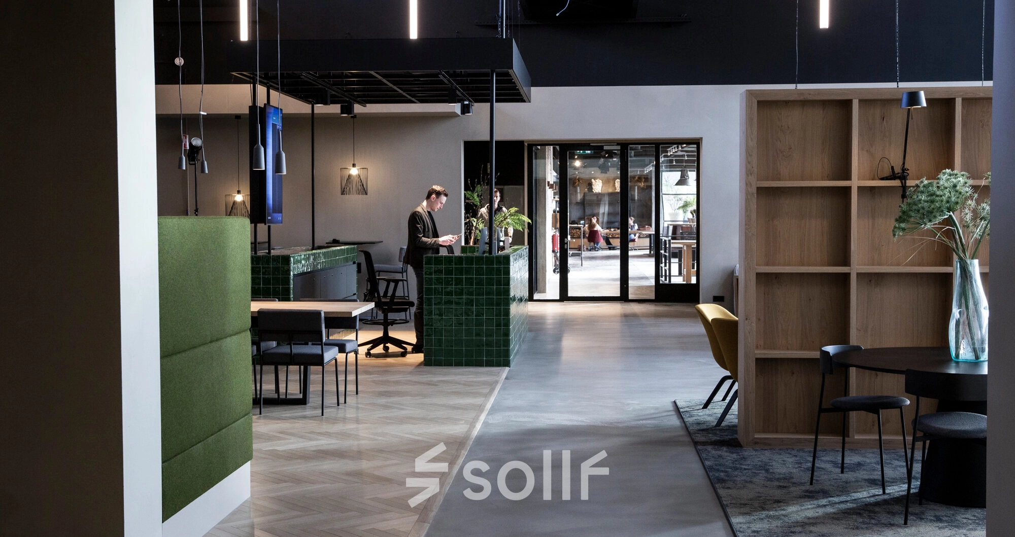 Stylish office space at Atoomweg 63, Utrecht Lage Weide, featuring a modern interior with people engaged in business activities. Ideal for office space rental with contemporary furnishings and functional design.