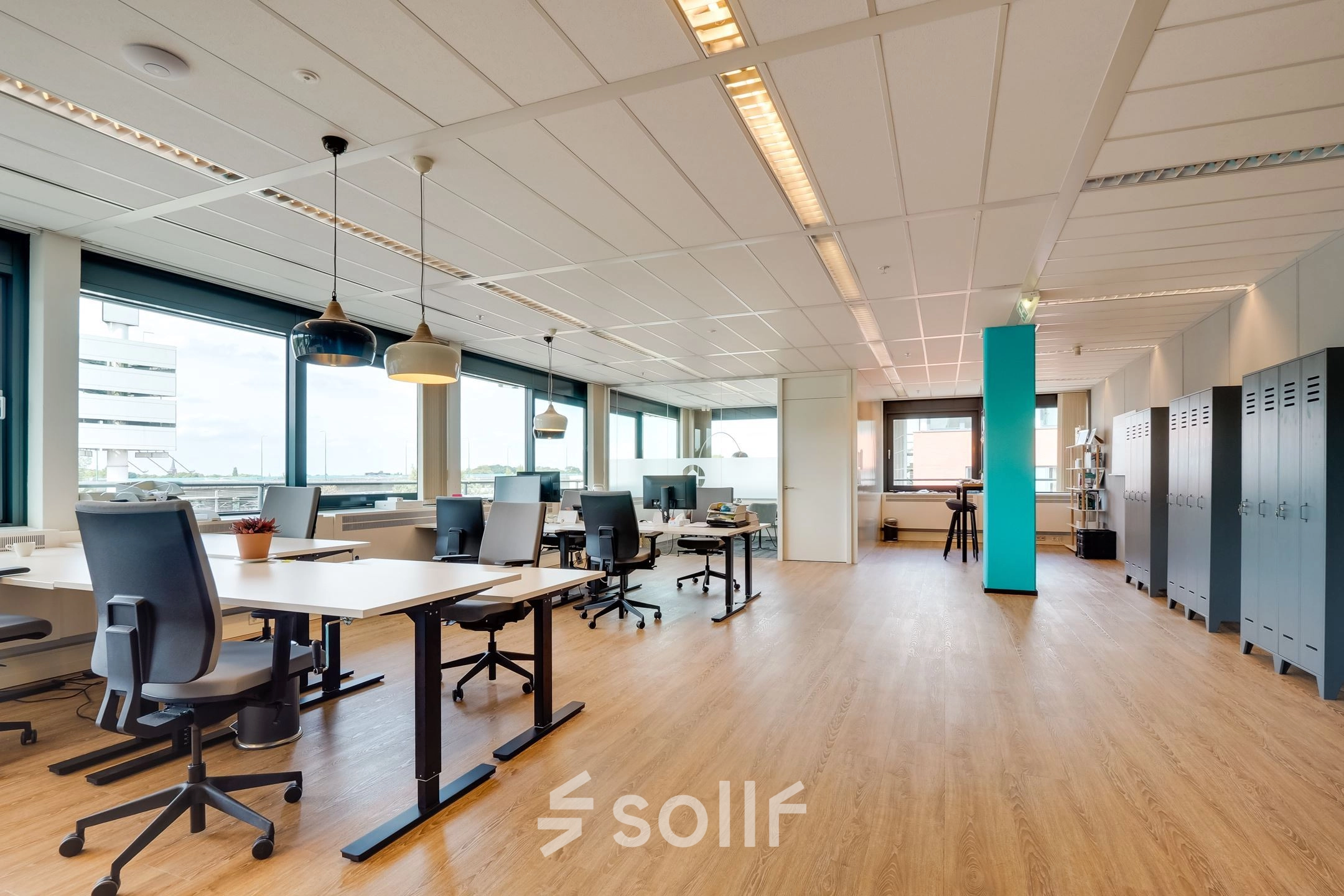 Spacious office space with desks and chairs available for rent at Computerweg 22, Utrecht Lage Weide. Large windows provide natural light.
