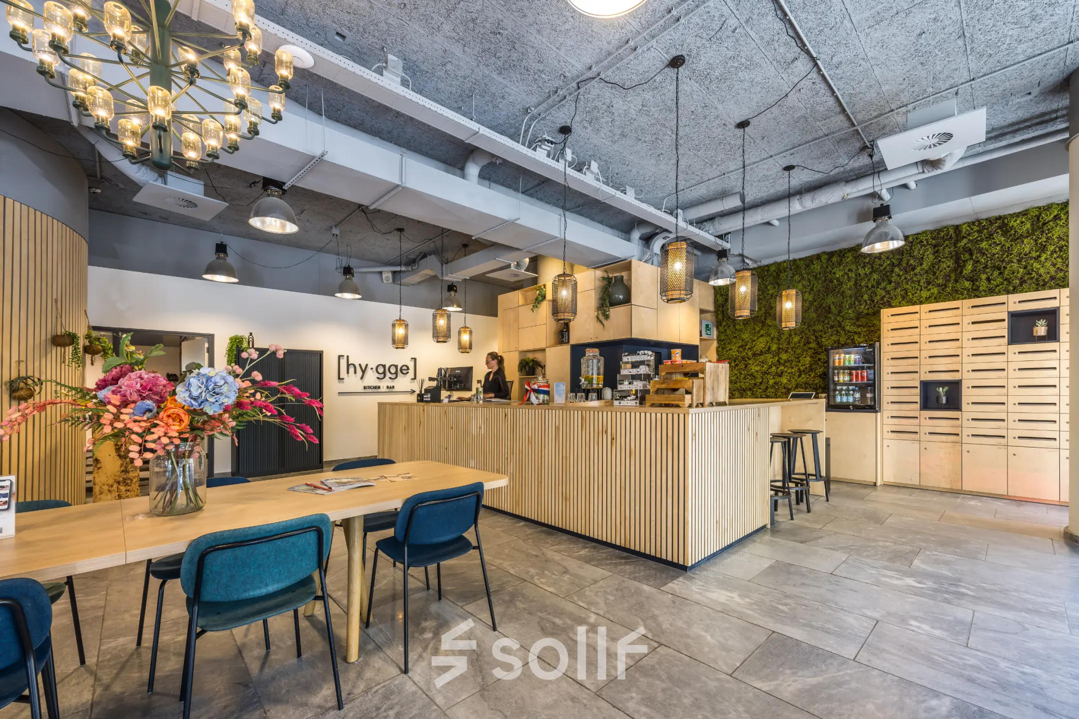 Modern office space in Utrecht North with a welcoming reception area featuring wooden decor and ample seating. Ideal for anyone seeking office space rental.
