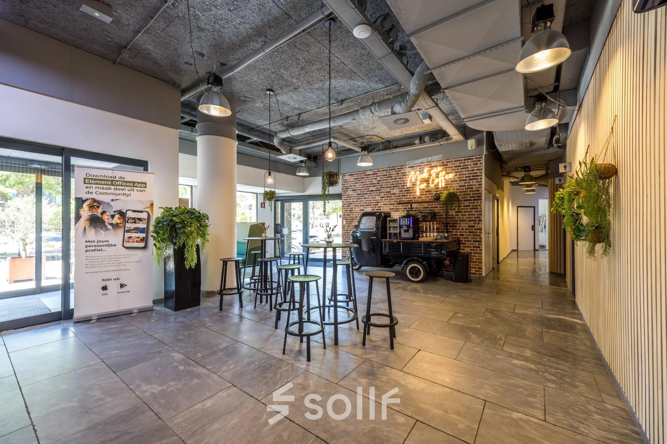 Vibrant interior space at Goeman Borgesiuslaan 77, Utrecht North, ideal for office space rental with modern decor and ample seating.