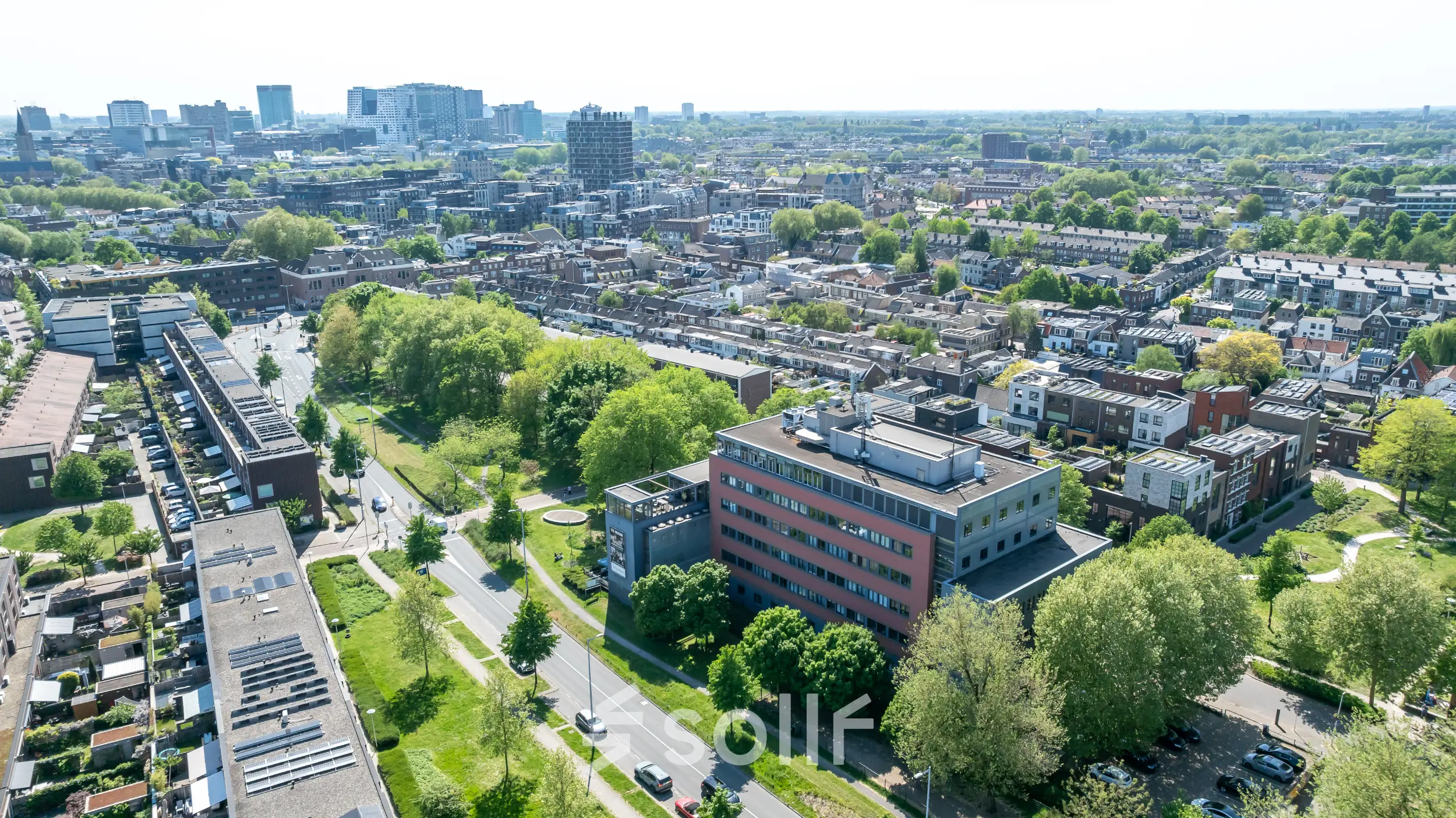 Aerial view of the office building located at Goeman Borgesiuslaan 77 in Utrecht North, surrounded by greenery and urban landscape.