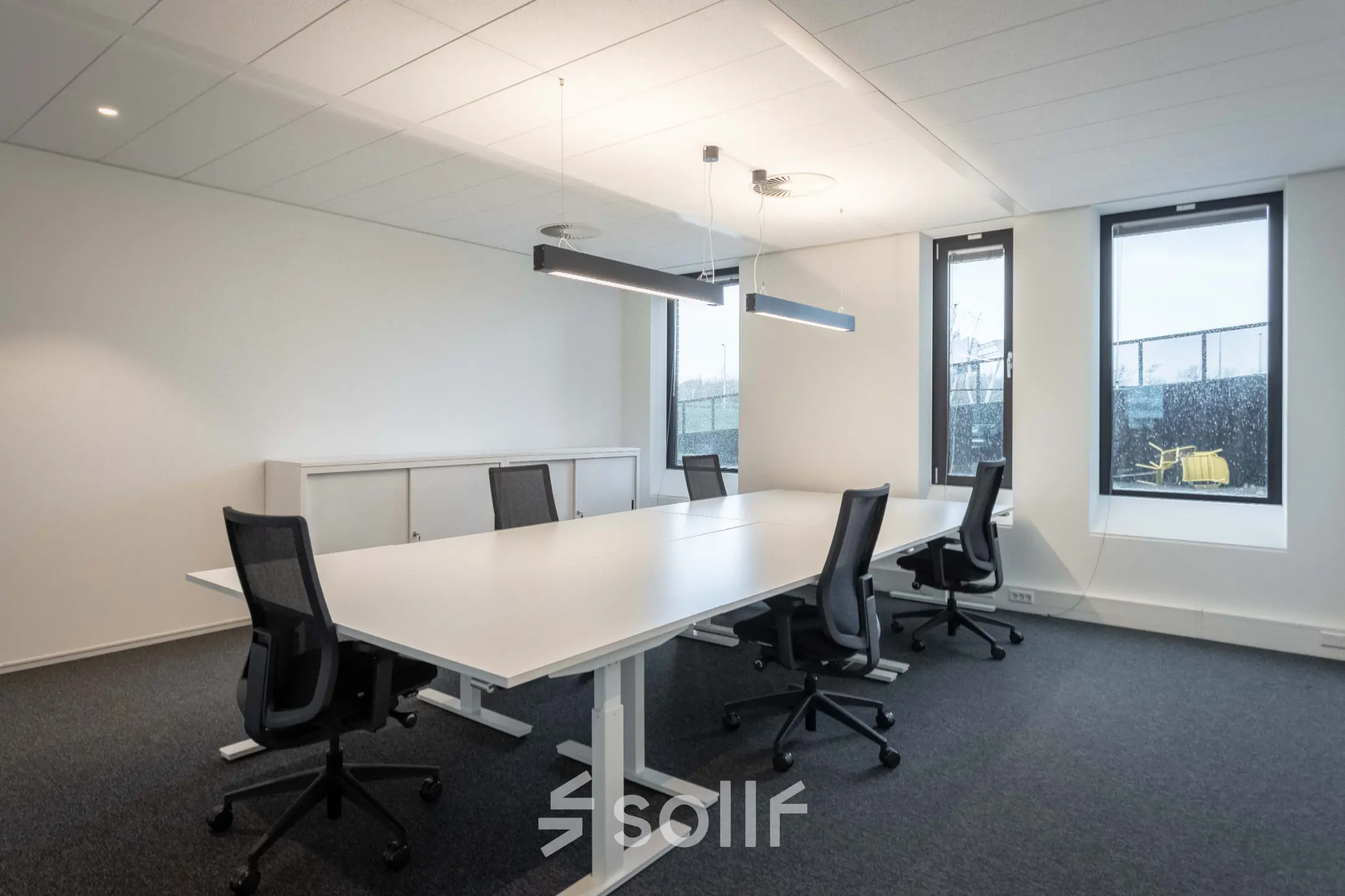 Spacious office space rental at Van Deventerlaan 31-51, Utrecht Papendorp, featuring a modern conference room with a large table and stylish chairs.