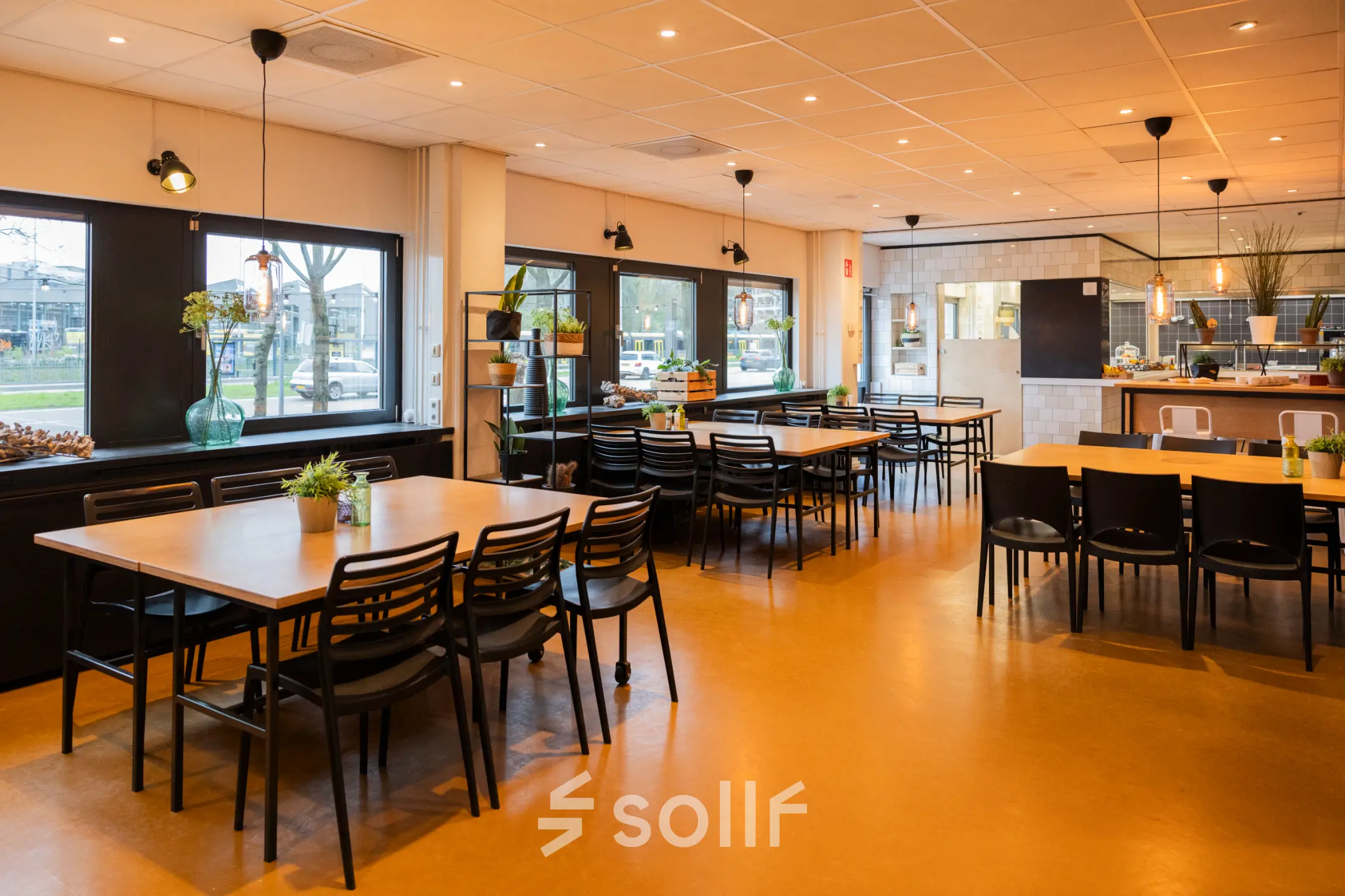 Spacious, well-lit office interior at Winthontlaan 200 in Utrecht South, featuring multiple tables and chairs available for office space rental.