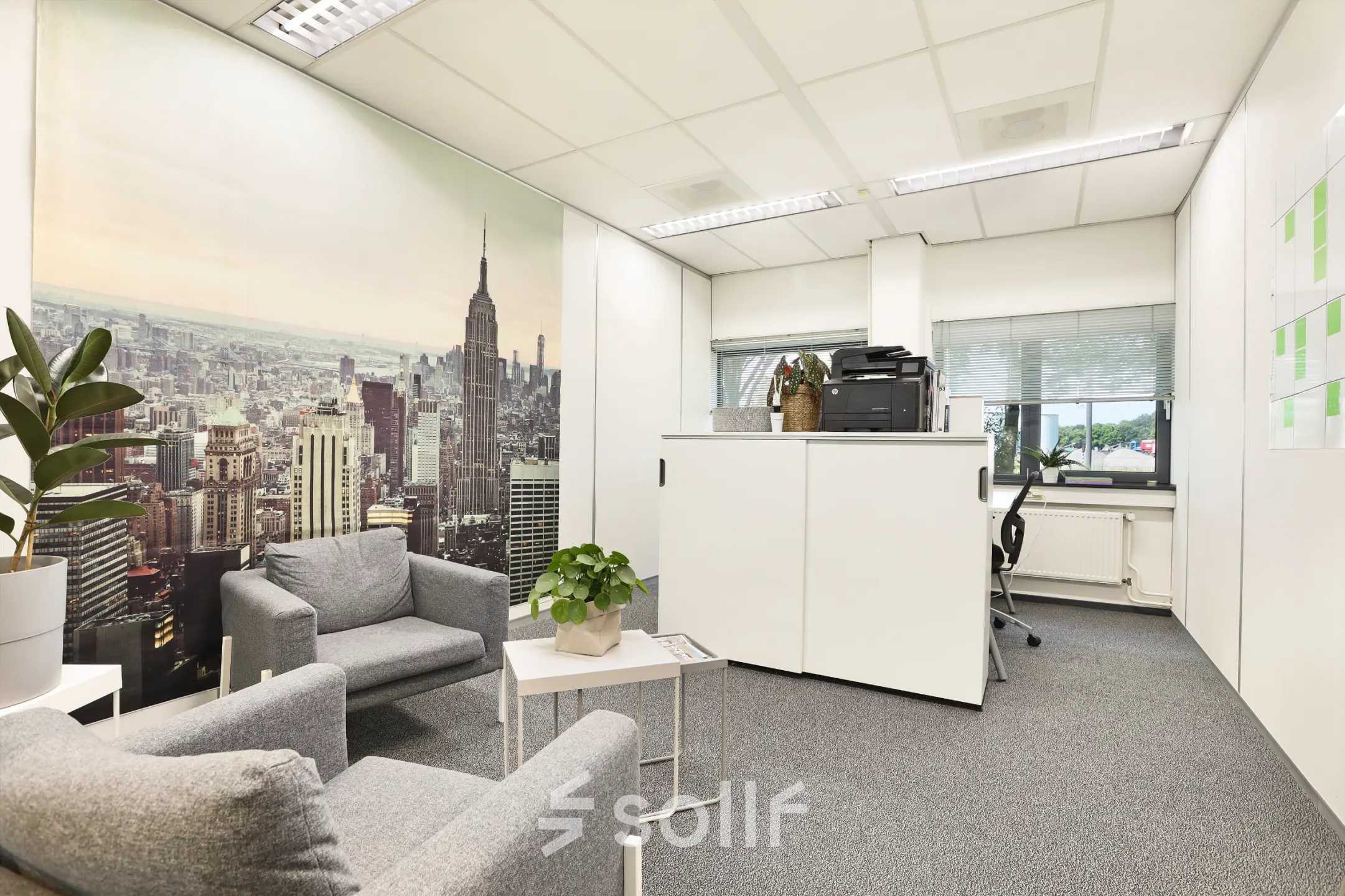 Office space at Winthontlaan 200, Utrecht South featuring comfortable seating and office equipment, available for rent. Bright workspace with modern decor ideal for business activities.