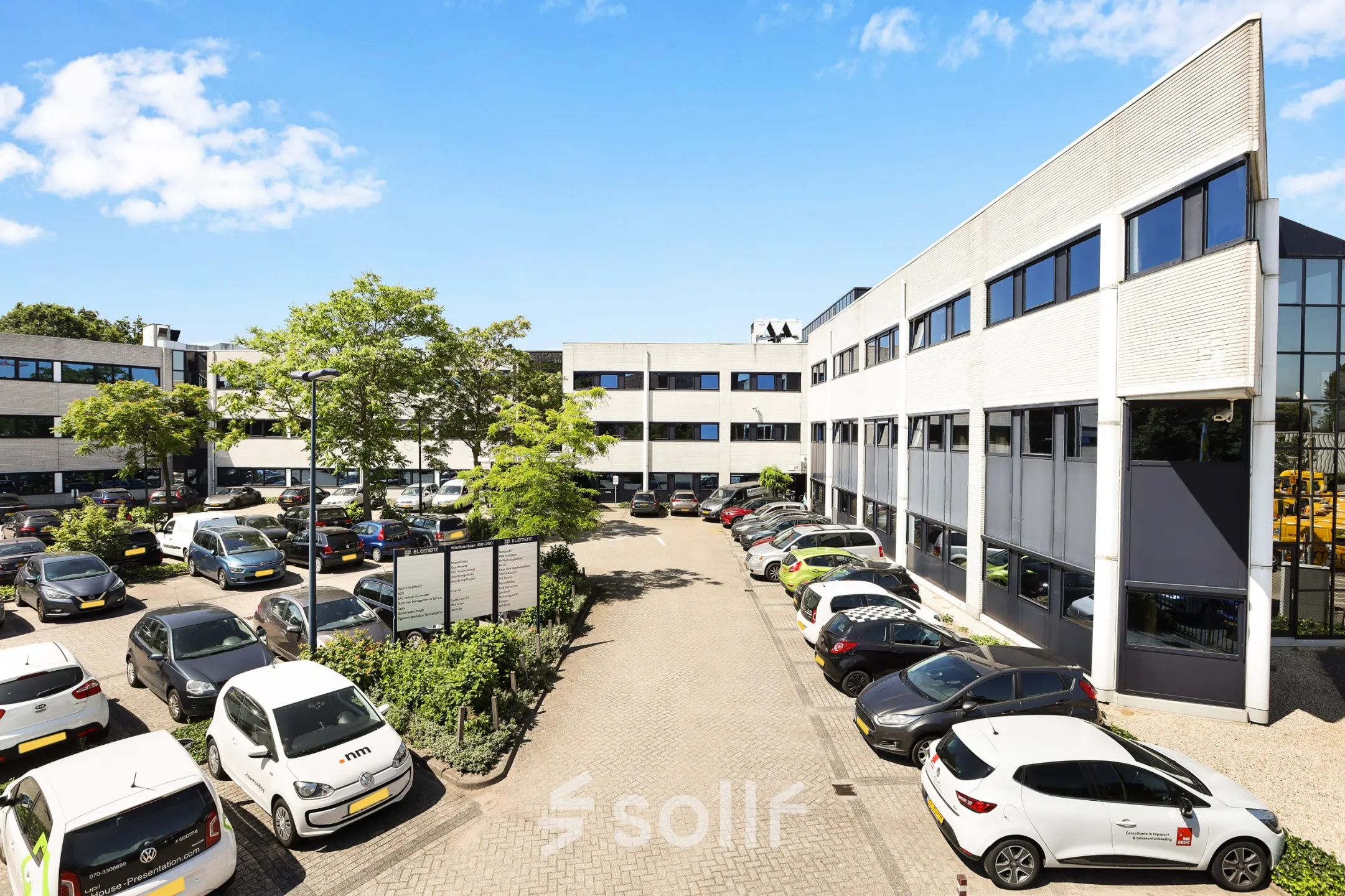 Exterior view of Winthontlaan 200 in Utrecht South, showcasing ample parking and modern office buildings available for rent.