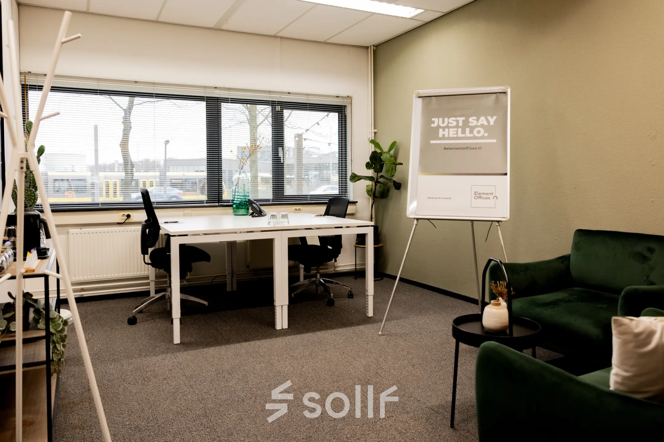 Cozy office space at Winthontlaan 200, Utrecht South, featuring desks, chairs, and a presentation stand, available for office space rental.