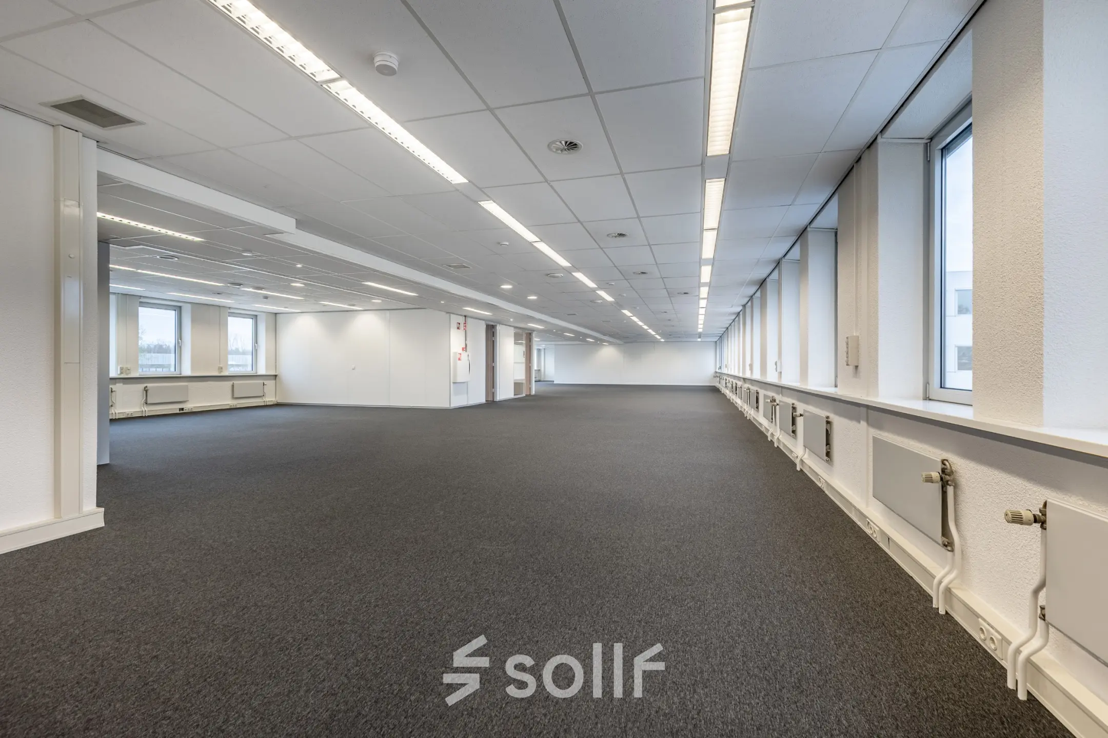 Spacious office space available for rental at De Run 1141-1157, Veldhoven, featuring ample lighting and a versatile layout.