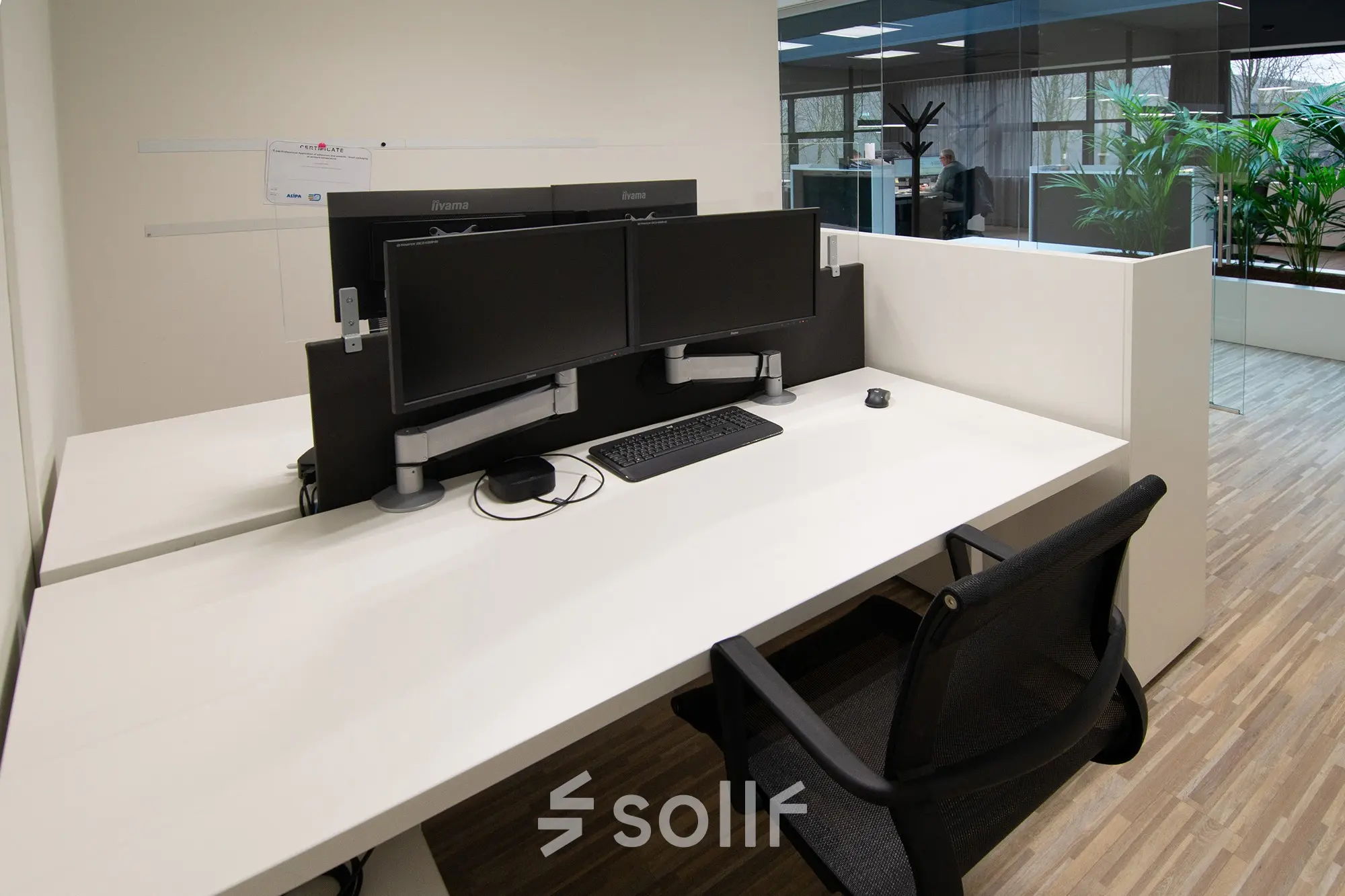 Modern office workspaces available for rent at Gildestraat 13, Velp. The interior features sleek desks with dual monitors, ready for immediate office space rental.