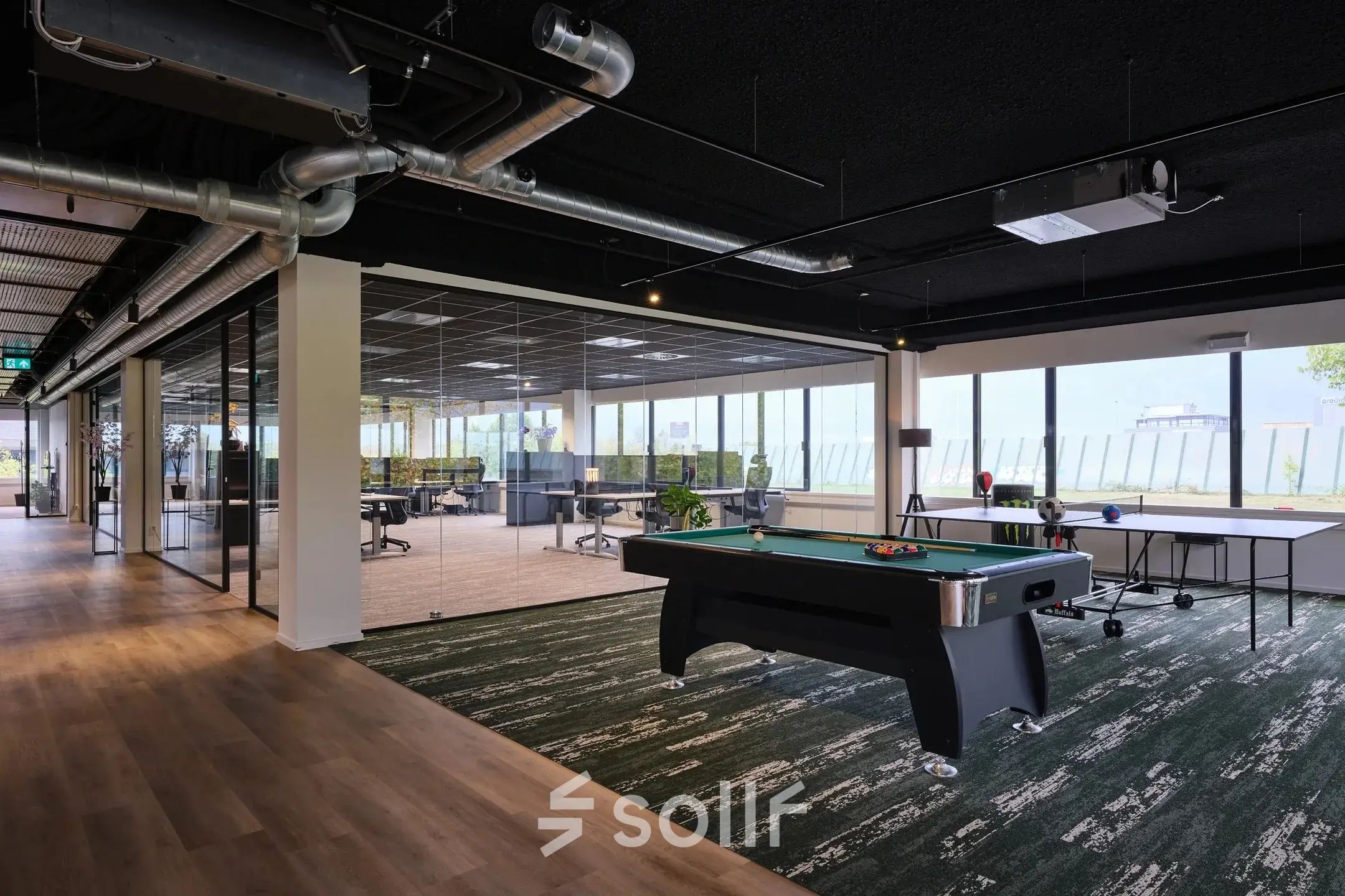 Modern office space with sleek workstations and a pool table, suitable for office space rental and creative work environment at Havenweg 24, Vianen Utr.