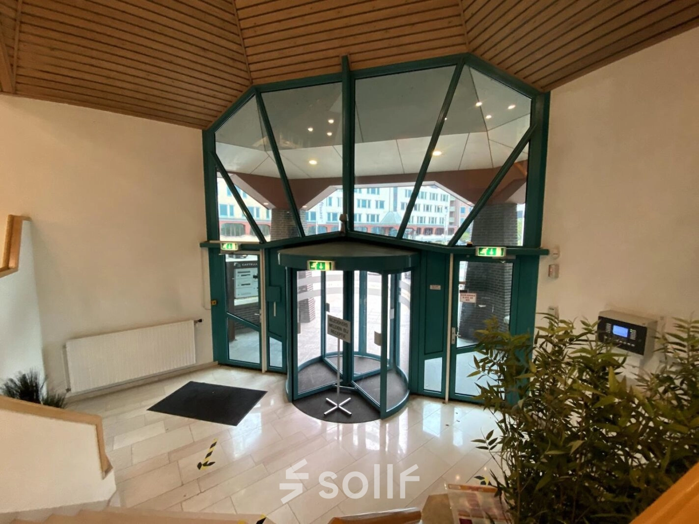Spacious entrance with large glass doors at Loire 104 - 206 in Voorburg, offering a professional setting perfect for office space rental.