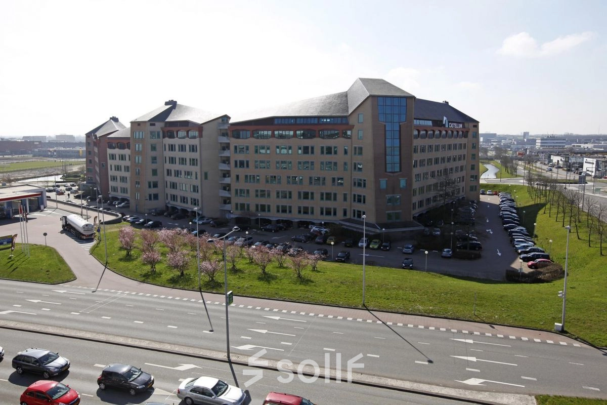 Exterior view of a modern office building at Loire 104-206 in Voorburg, featuring ample parking and easy access for potential office space rental.