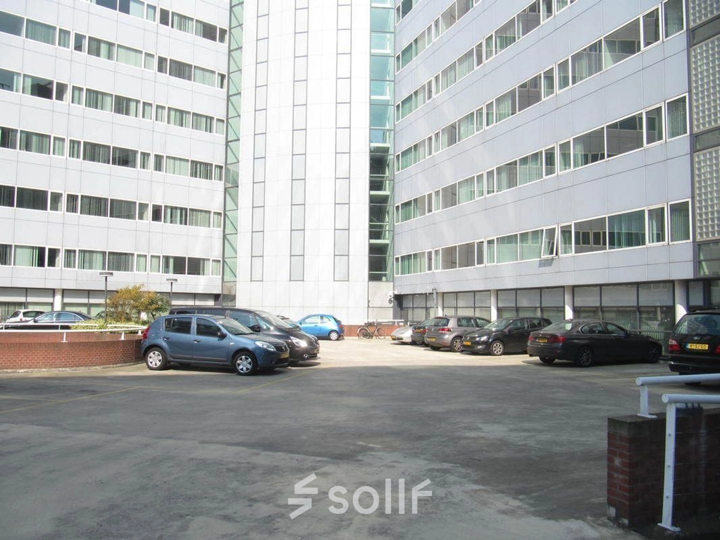 Parking area of the office building at Regulusweg 11 in Voorburg, suitable for those seeking convenient office space rental.