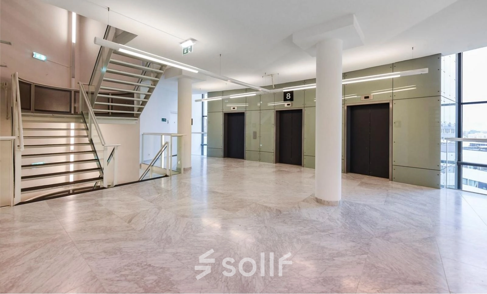 Spacious interior of Regulusweg 11, Voorburg, showcasing elevator lobby, ideal for office space rental with sleek design.