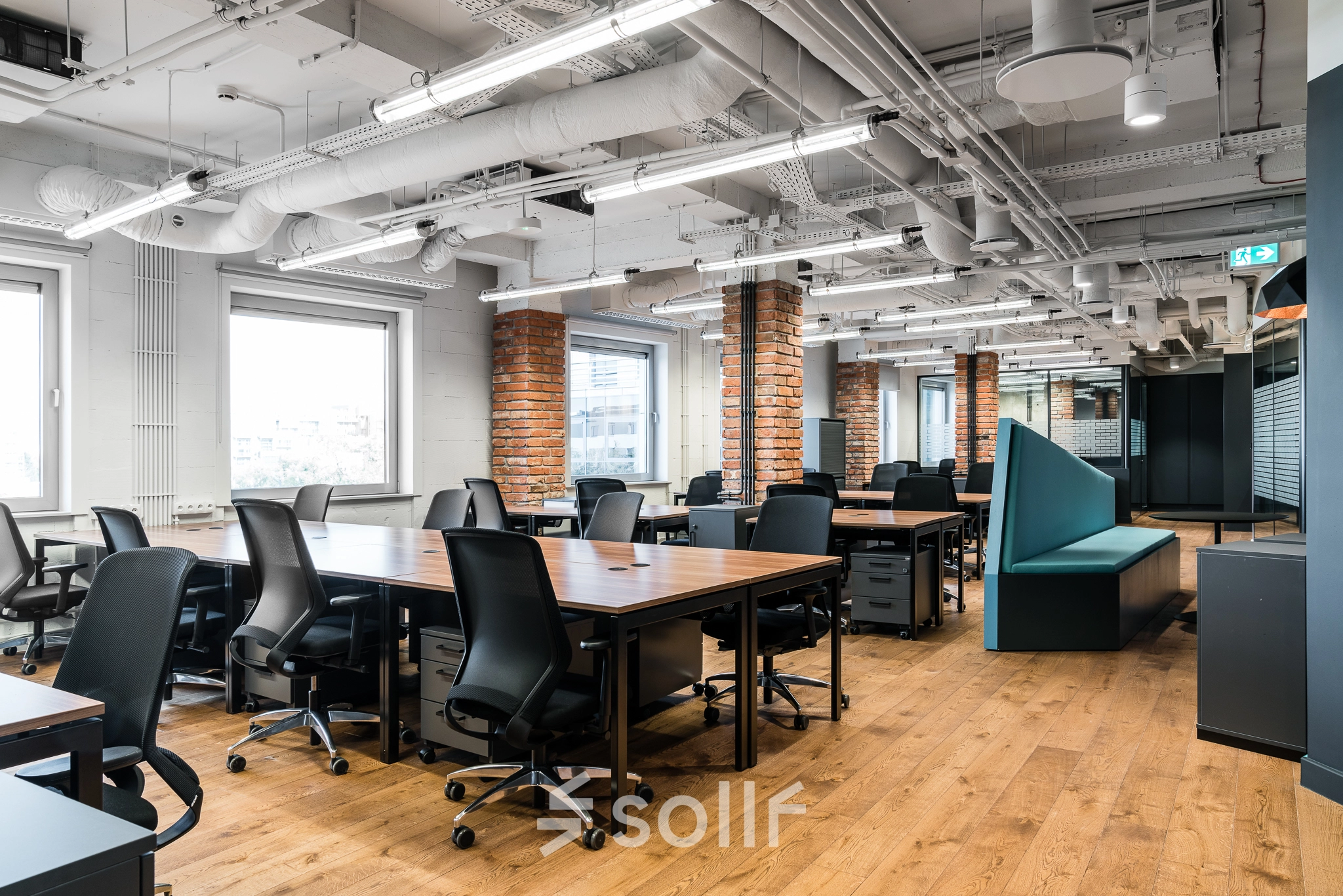 Spacious office to rent at Konstruktorska 11, Warsaw Mokotow, featuring modern furniture and open floor plan ideal for collaborative work.