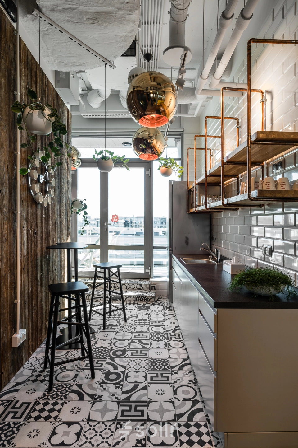 Modern and stylish kitchen area in an office space located at Konstruktorska 11, Warsaw Mokotow, ideal for office space rental.