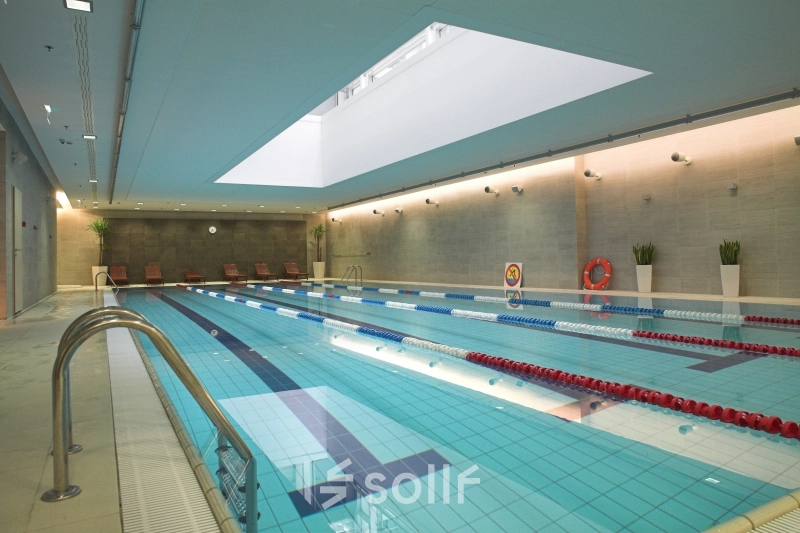 Spacious indoor swimming pool at Postępu 17A, Warsaw Mokotow, perfect for relaxation during office breaks. Consider this unique office space rental opportunity.