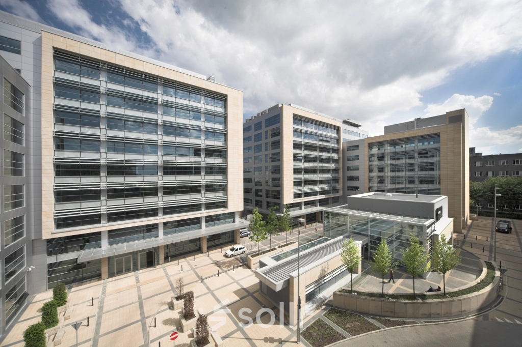 Exterior view of modern office buildings at Postępu 17A, Warsaw Mokotow, ideal for office space rental.
