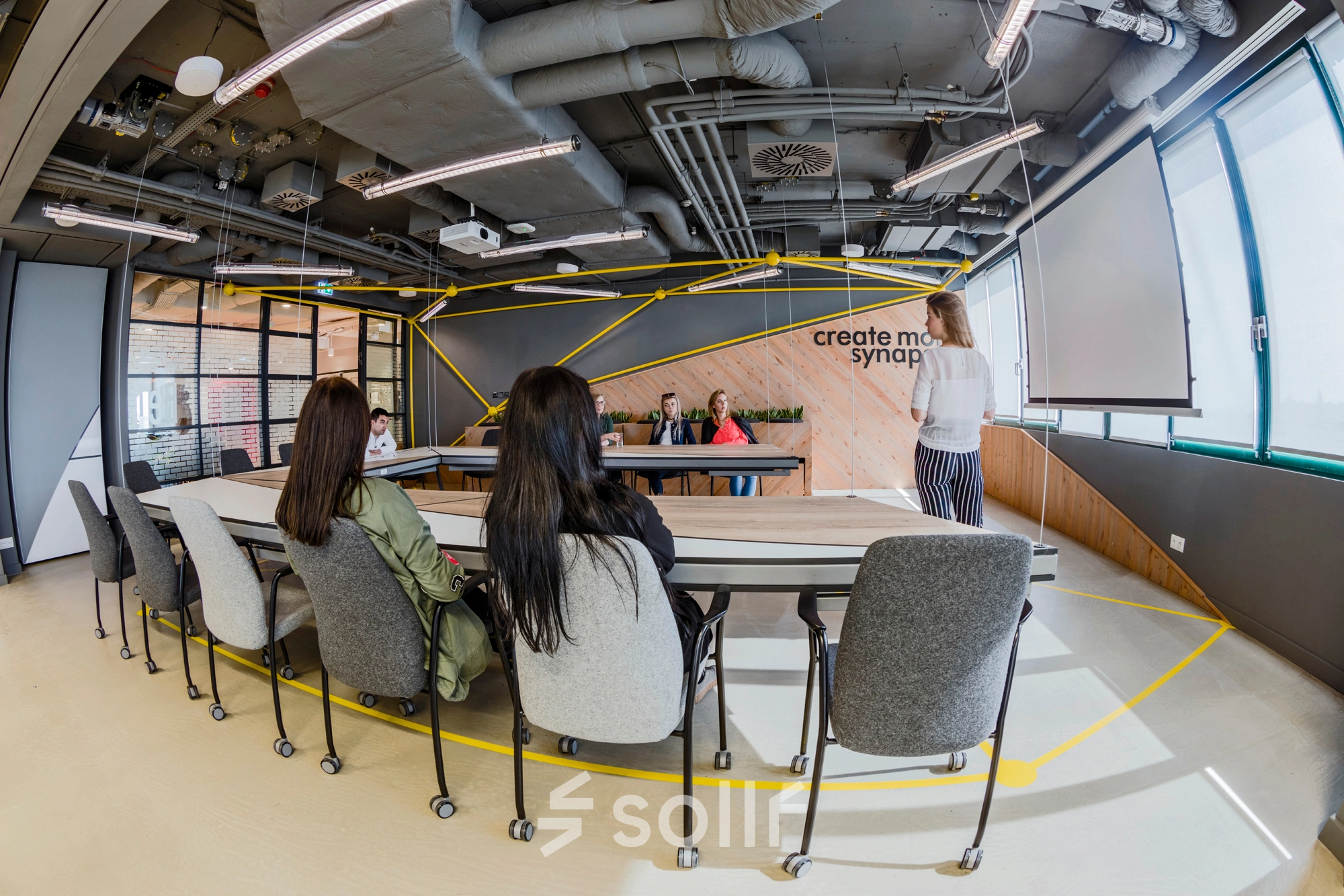 Business meeting in a stylish office space with modern furnishings at Al. Jerozolimskie 181B, Warsaw Ochota. Perfect for office space rental or finding an office to rent.