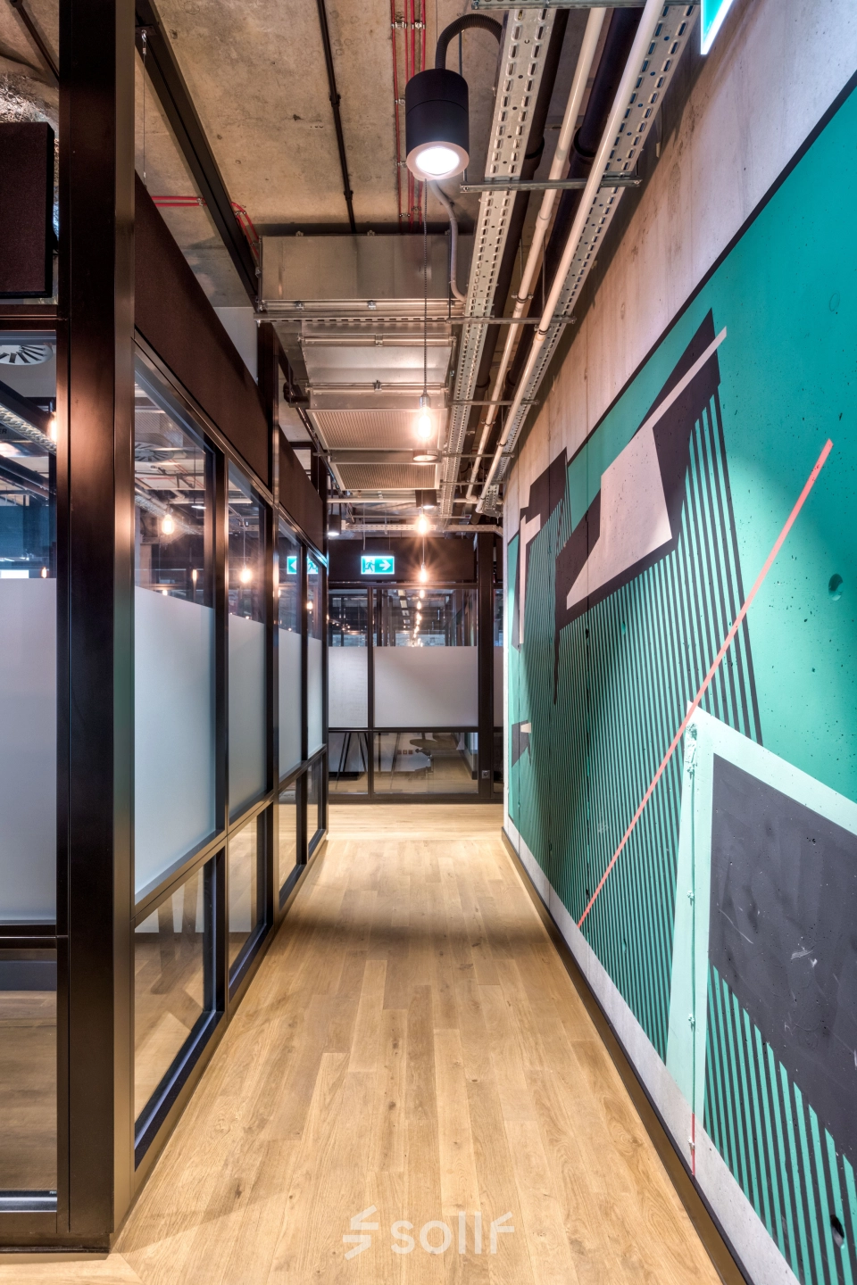 Corridor in Koszykowa 61 office space with modern decor and hallway lighting in Warsaw Śródmieście. Ideal for office space rental.