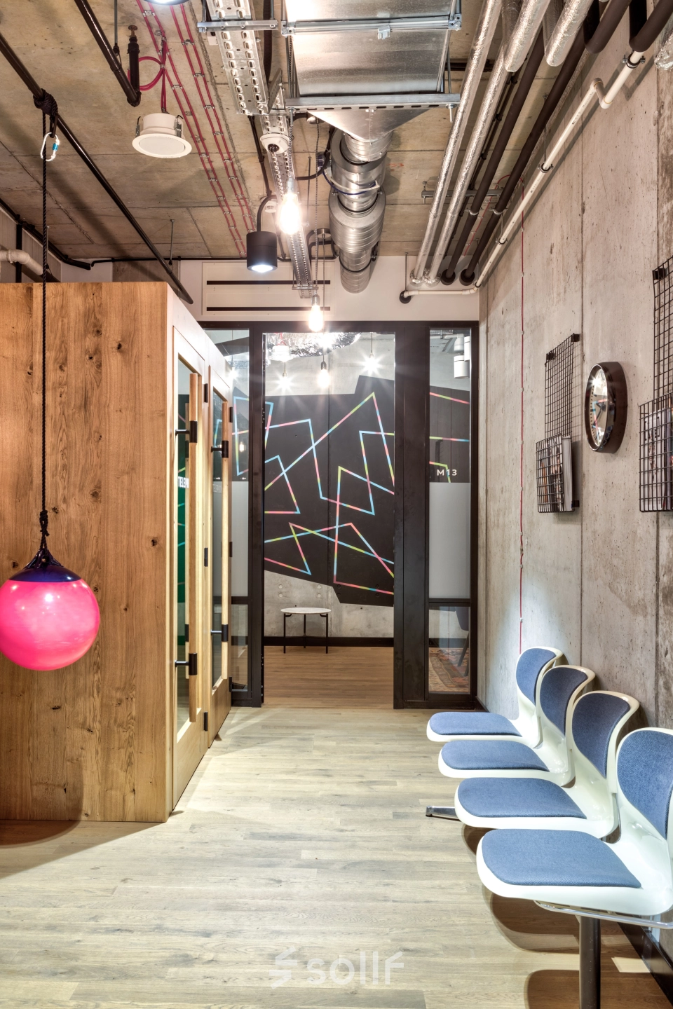 Modern office space with stylish seating and unique decorations, located in Warsaw Śródmieście. Ideal for rent office space needs.