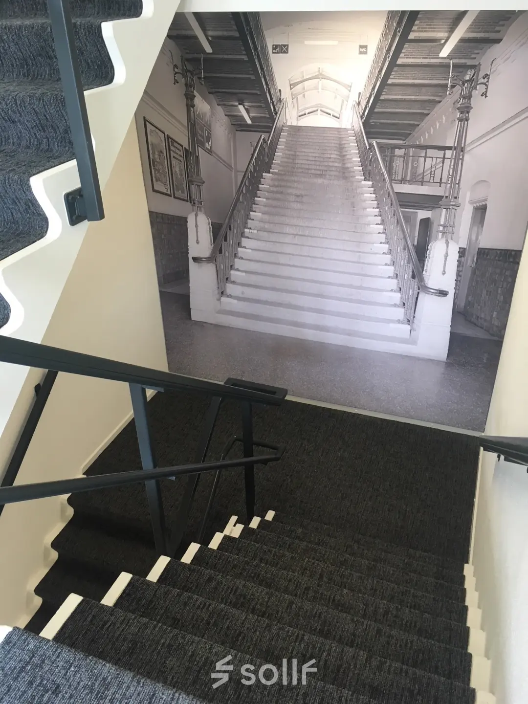 Staircase with patterned wall showcasing an artistic stair photo at the office located at Houttuinlaan 4, Woerden.