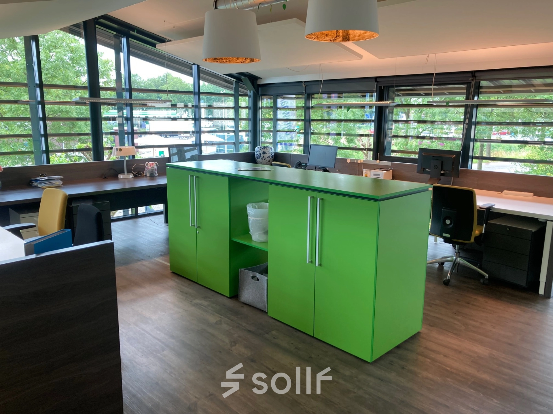 Bright, modern open floorplan office at M.A. Reinaldaweg 2d, Woerden, featuring large windows, sleek furniture, and ample natural lighting. Ideal for those seeking office space rental in a vibrant environment.