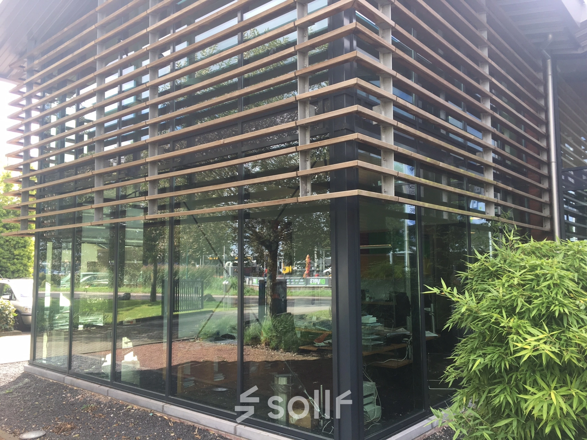 Exterior of an office building at M.A. Reinaldaweg 2d in Woerden, showcasing modern glass architecture suitable for office space rental.