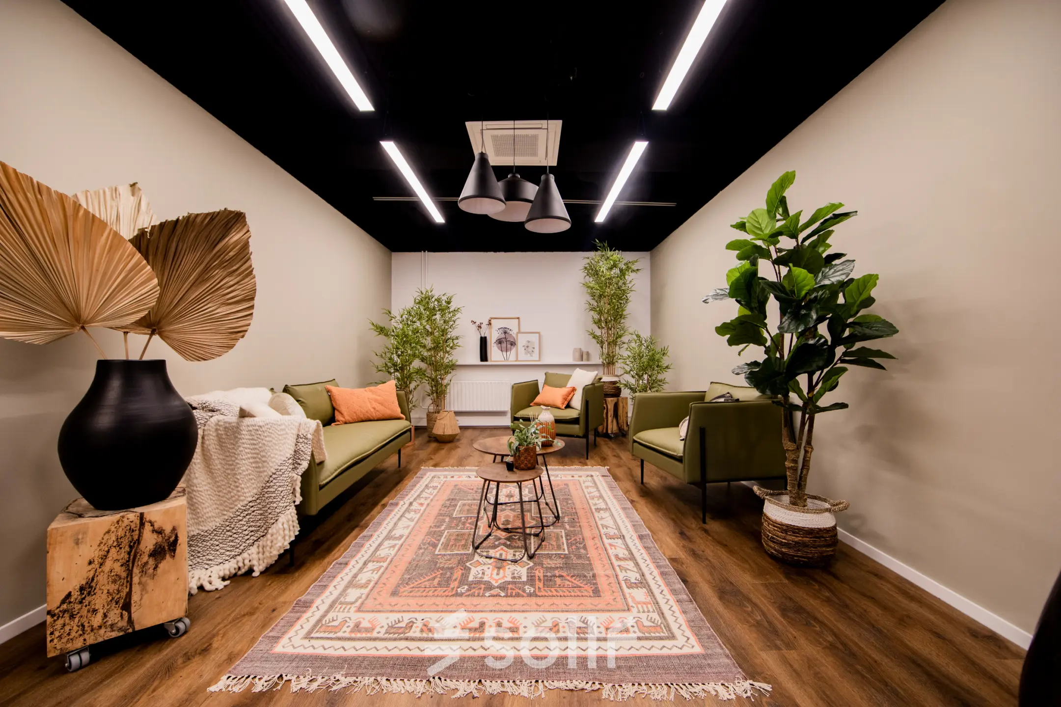 Inviting office space with modern decor, featuring comfortable seating and lush greenery, ideal for rent in Woerden.