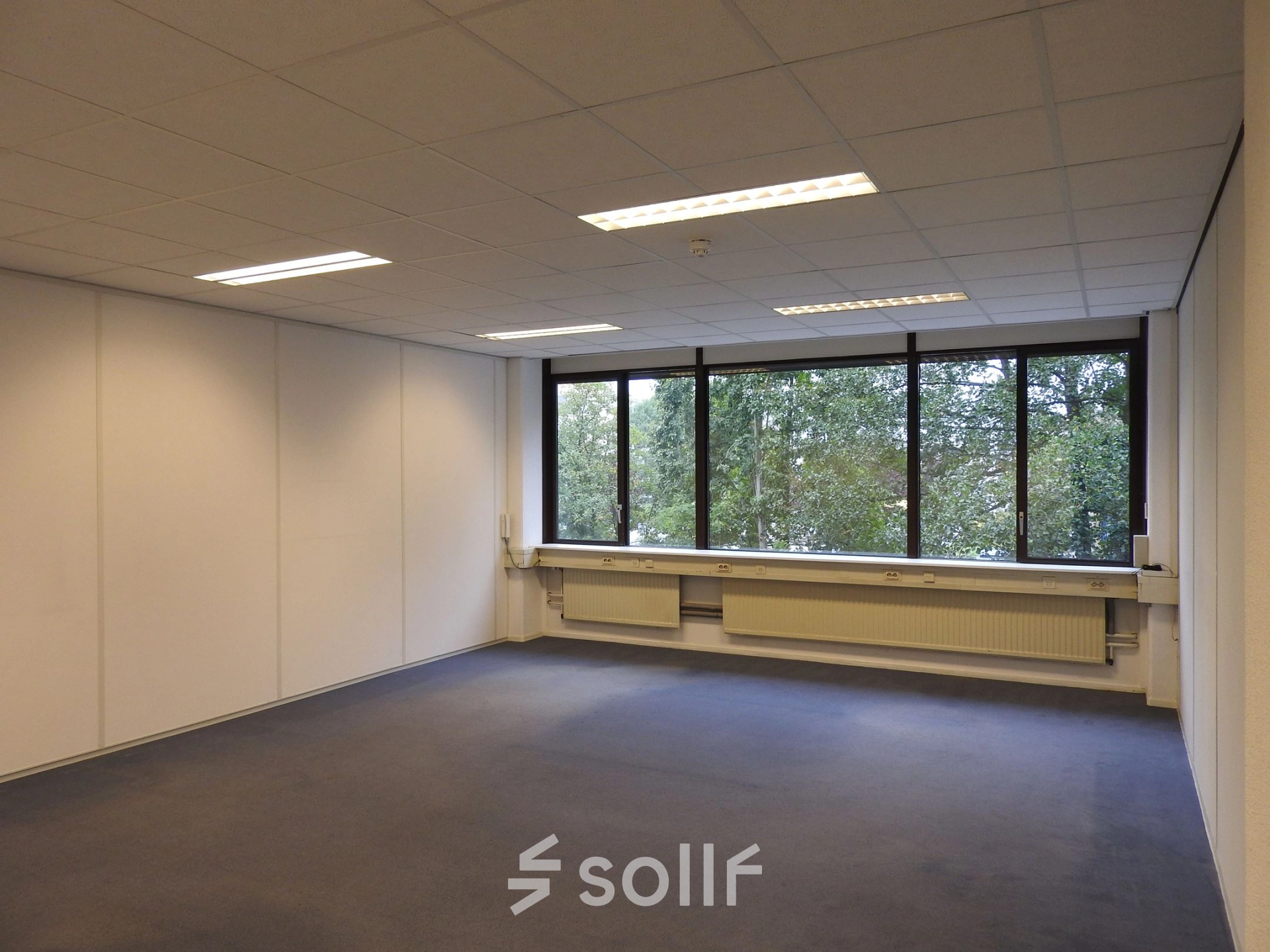 Spacious unfurnished office space with large windows at Zaagmolenlaan 4, ideal for rent office space opportunities in Woerden.
