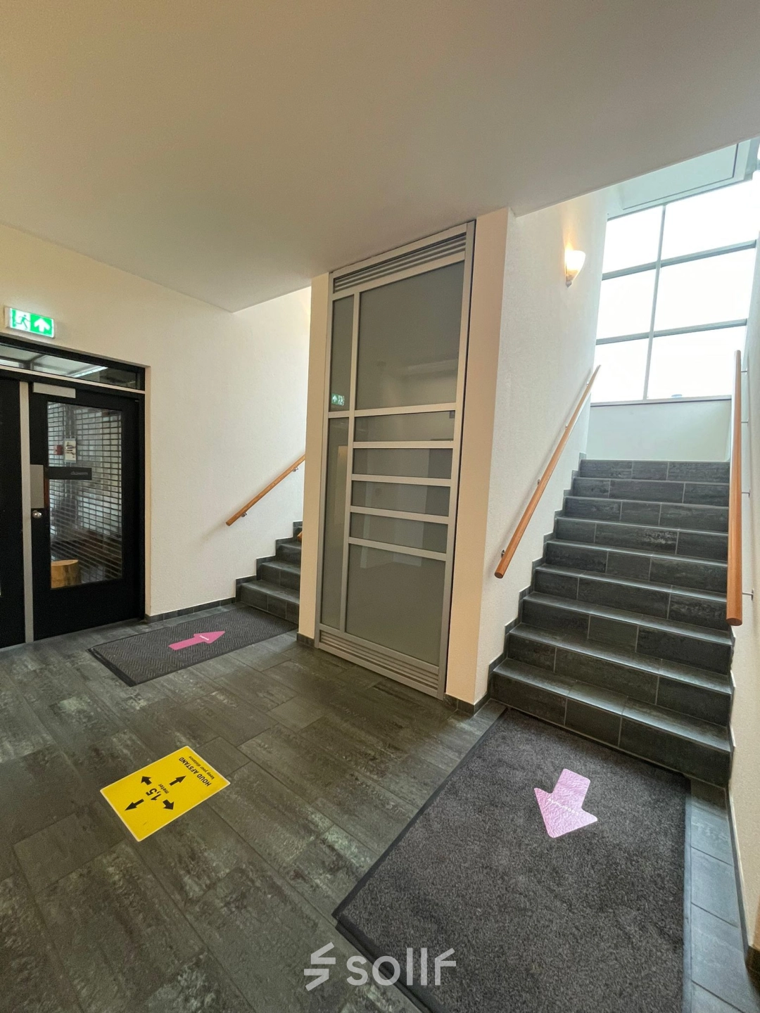 Entrance area at Baron de Coubertinlaan 35, Zoetermeer, featuring clean stairs and signage ideal for office space rental.