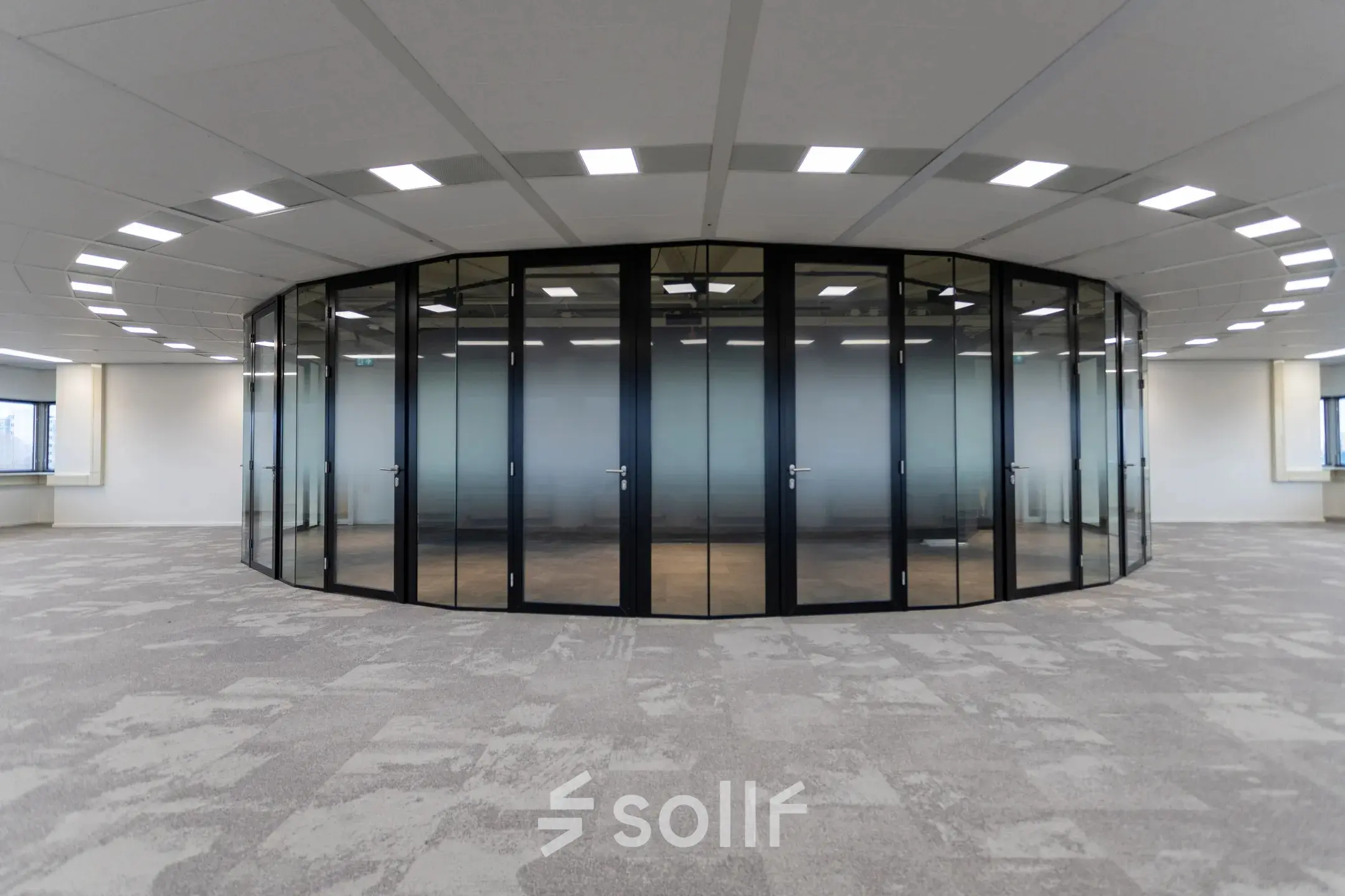 Modern office space with circular glass-walled room at Boerhaavelaan 40 in Zoetermeer, ideal for office space rental.