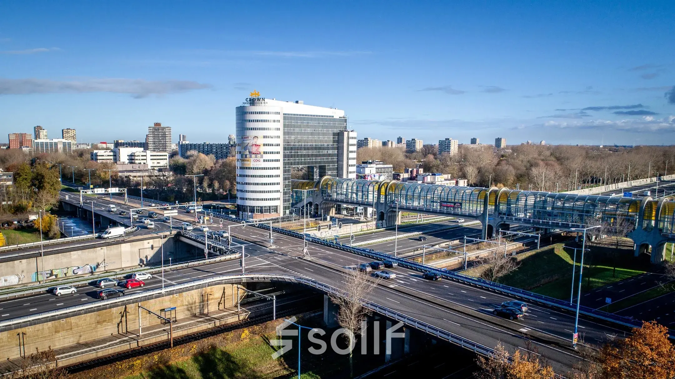 Aerial view of a modern office building at Boerhaavelaan 40, Zoetermeer, surrounded by roads and a bridge.