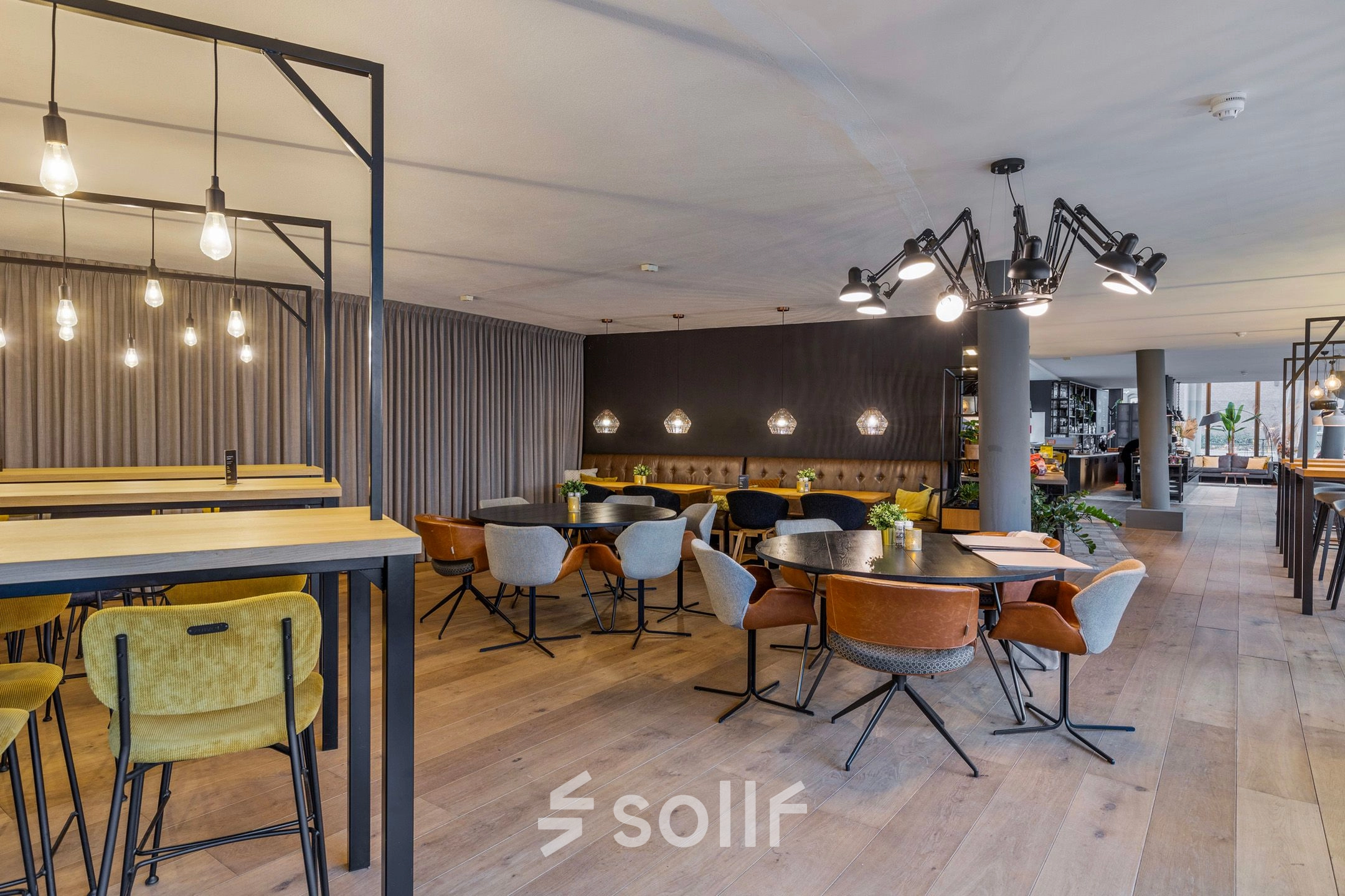 Modern office to rent at Assendorperdijk 1 in Zwolle featuring stylish furnishings with multiple seating areas, perfect for collaborative work.