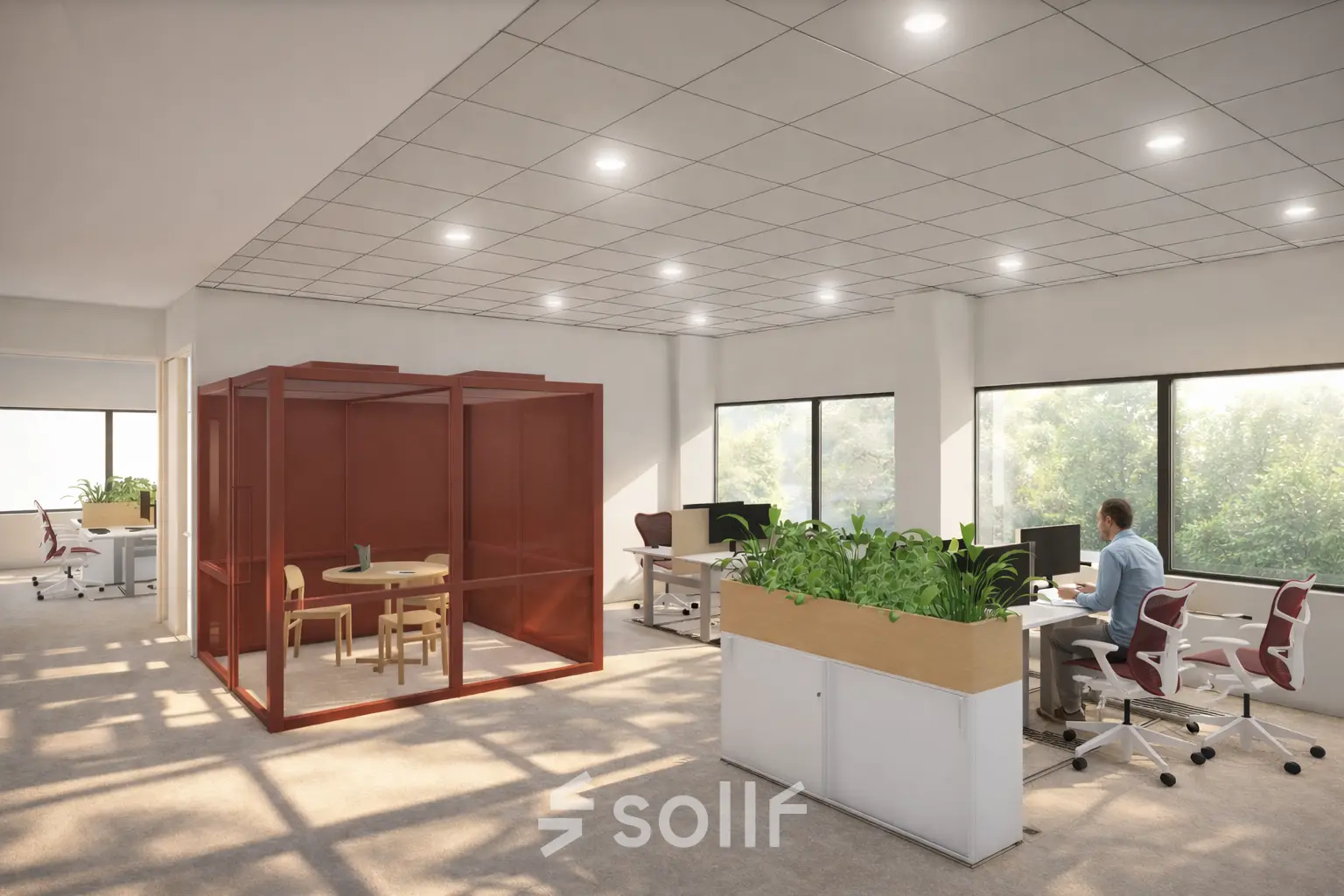 Kantoorruimte te huur in Amsterdam Zuid-Oost op Luttenbergweg 8 met moderne werkplekken en glazen vergaderruimte. Een persoon werkt aan een bureau in een lichte, groene omgeving.