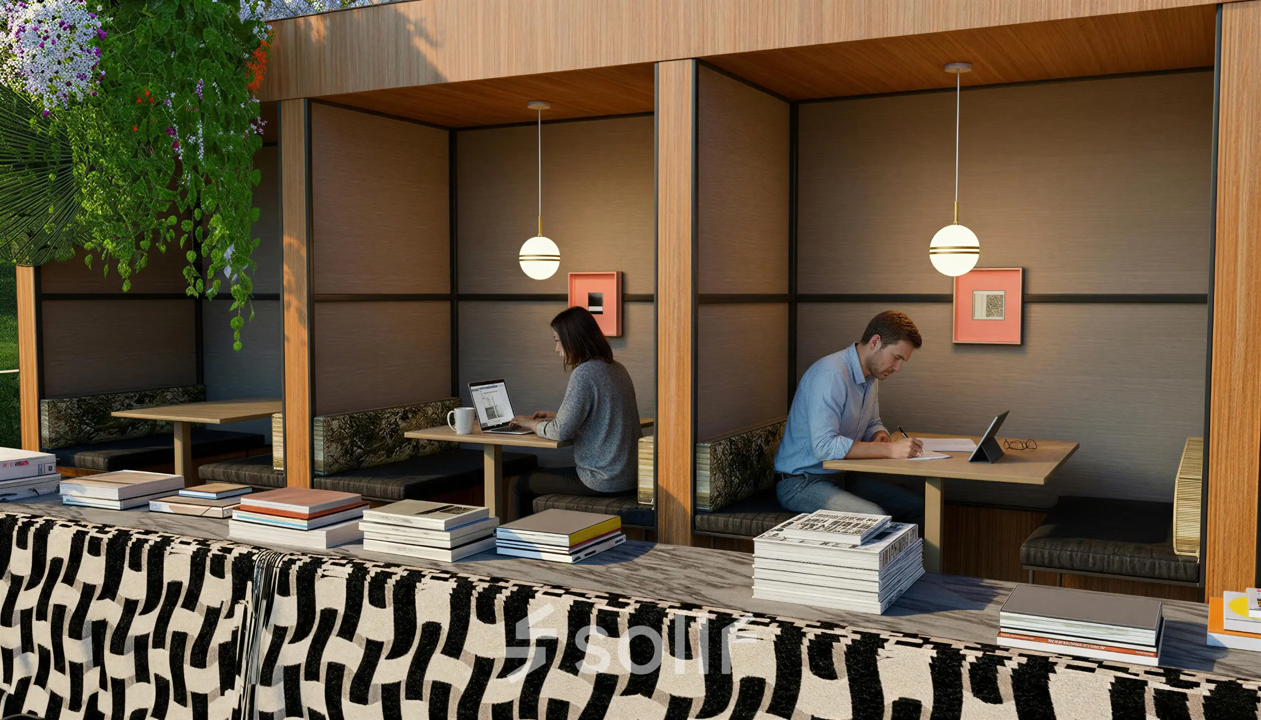 Kantoorruimte aan de Barbara Strozzilaan 101 101 in Amsterdam Zuidas met meerdere nissen waar mensen geconcentreerd werken aan laptops, omgeven door een huiselijk interieurontwerp met natuurlijke accenten.