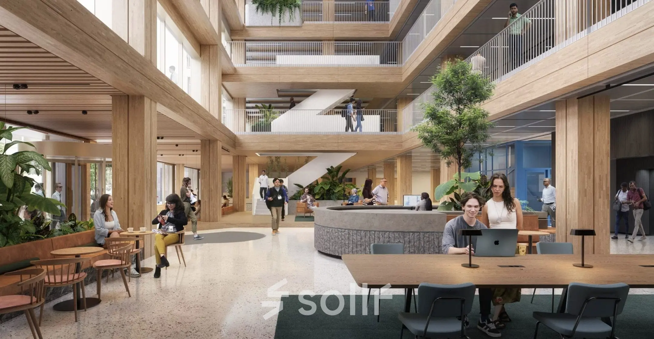 Moderne kantoorruimte op Coolsingel 75, Rotterdam Centrum met meerdere verdiepingen. Mensen werken en ontspannen in een ruime en groene omgeving met houten elementen.