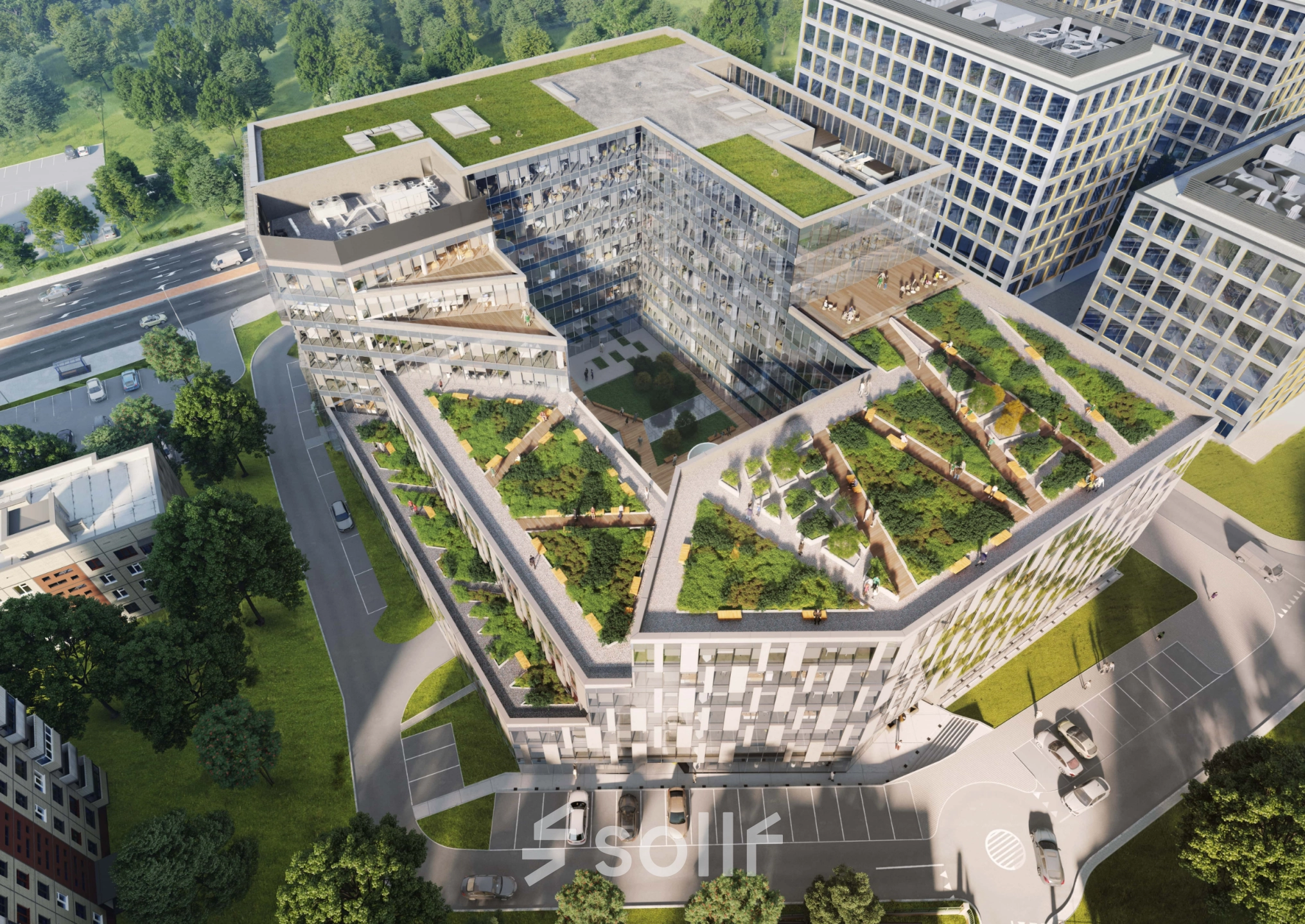 Widok z lotu ptaka na nowoczesny budynek biurowy przy Tischnera 8 w Kraków Podgórze z zielonymi tarasami i przestronnym otwartym planem.