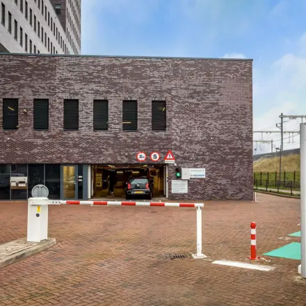 Exterior view of Landdrostdreef 124, Almere Stad, showing office space rental entrance with parking access.