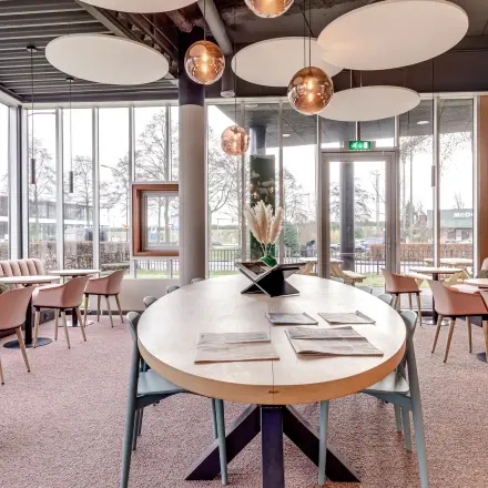 Modern and inviting office space rental at Maanlander 47, Amersfoort Calveen, featuring stylish furnishings, ample natural light, and a comfortable atmosphere perfect for workspaces.