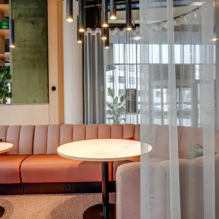 Stylish office lounge area at Maanlander 47, Amersfoort Calveen, perfect for office space rental with a cozy seating arrangement and modern decor.