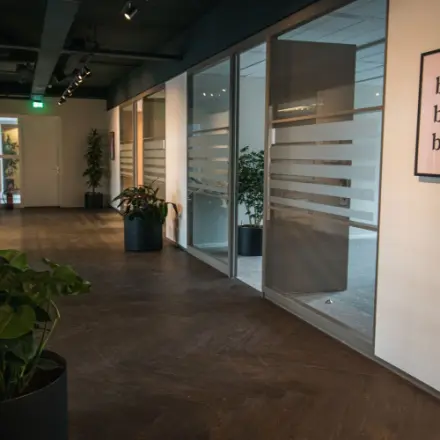 Interior hallway at Ruimtevaart 24, Amersfoort Calveen, ideal for office space rental with glass partitioned offices.