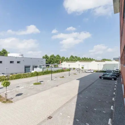 Exterior view of office buildings at Spoetnik 10-64, Amersfoort Calveen, showcasing available office space rental with parking facilities.
