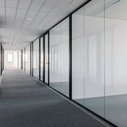 Modern office corridor at Stadsring 201, Amersfoort Centrum, showcasing sleek glass partitions ideal for office space rental opportunities.