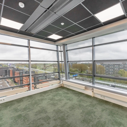 Spacious, unfurnished office space available for rent in Amsterdam Amstel Business Park, with large windows offering a panoramic view. Ideal for an office space rental.
