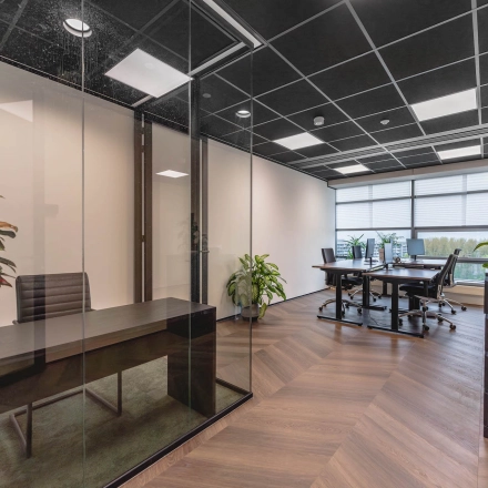 Modern office space with glass partitions and stylish furnishings at Joop Geesinkweg 201, Amsterdam Amstel Business Park, available for office space rental.