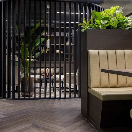 Furnished office space at Walborg 2A, Amsterdam Buitenveldert, featuring sleek seating and lush greenery, ideal for rent office space seekers.