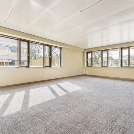 Bright and spacious unfurnished office space at Walborg 2A, Amsterdam Buitenveldert, offering ample natural light through large windows. Ideal for office space rental opportunities.