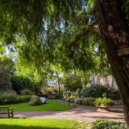 Lush garden view at Herengracht 582-584, Amsterdam Canal Belt, perfect for breaks from office space rental nearby.